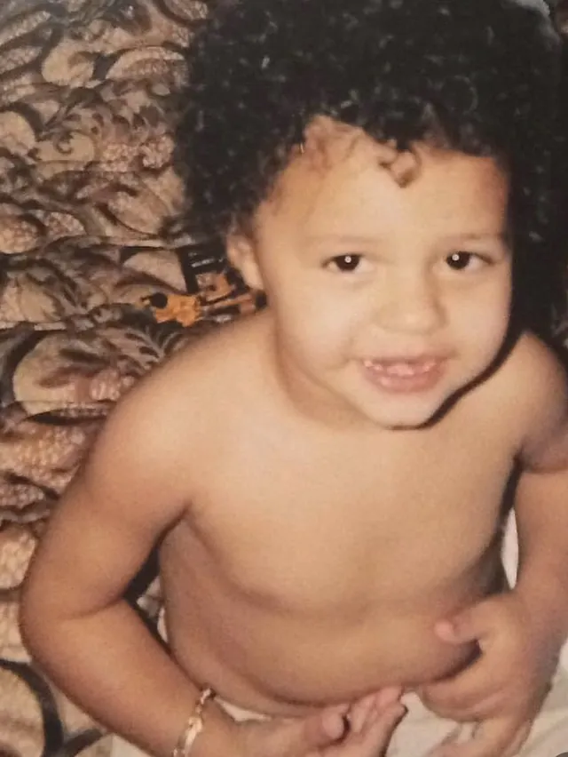 A childhood photo of Tyson Isa smiling as a toddler.