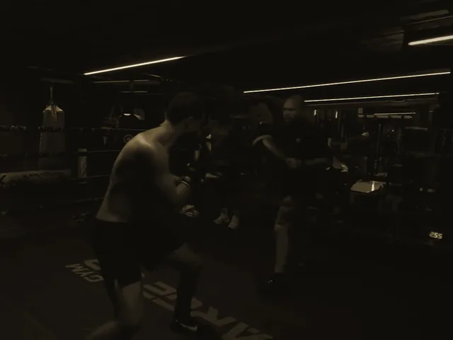 Tyson Isa moving through a pad-work round in the gym.